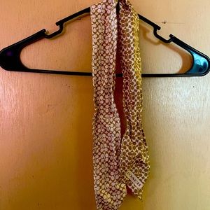 This is a silk scarf that can be worn two different ways. It’s 💯% authentic.